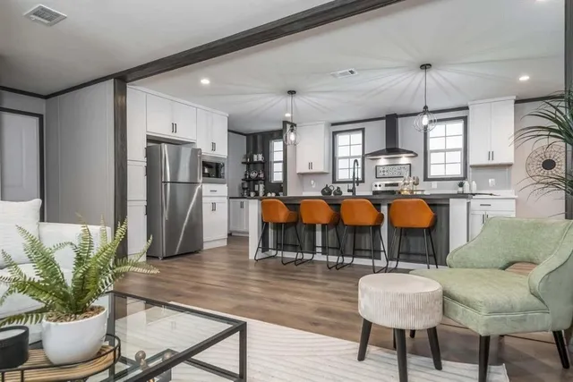 a dining room with furniture and chandelier