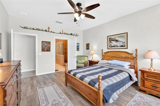 a bathroom with double vanity and a shower