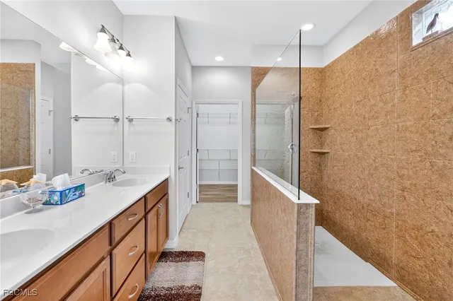 a bathroom with a double vanity sink mirror and double