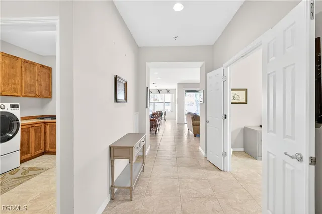 a kitchen with stainless steel appliances kitchen island granite countertop a table and chairs in it