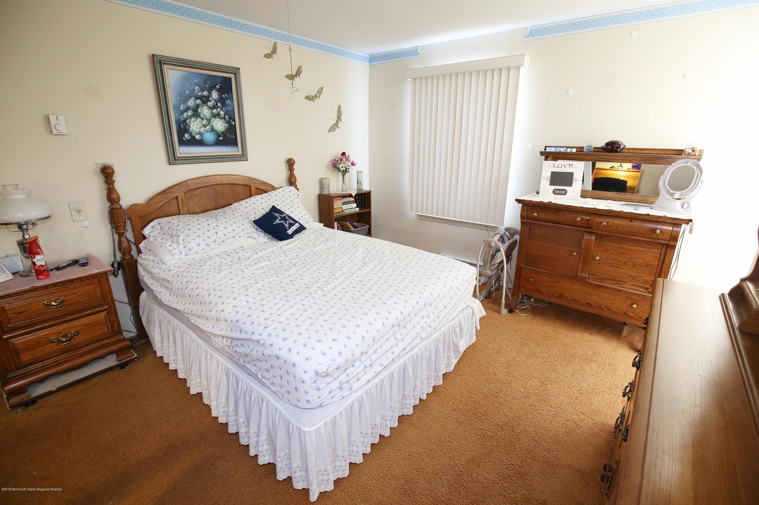 30A Mill Road, Unit C Whiting, NJ 08759 - Photo 16 of 23 a bedroom with bed and window