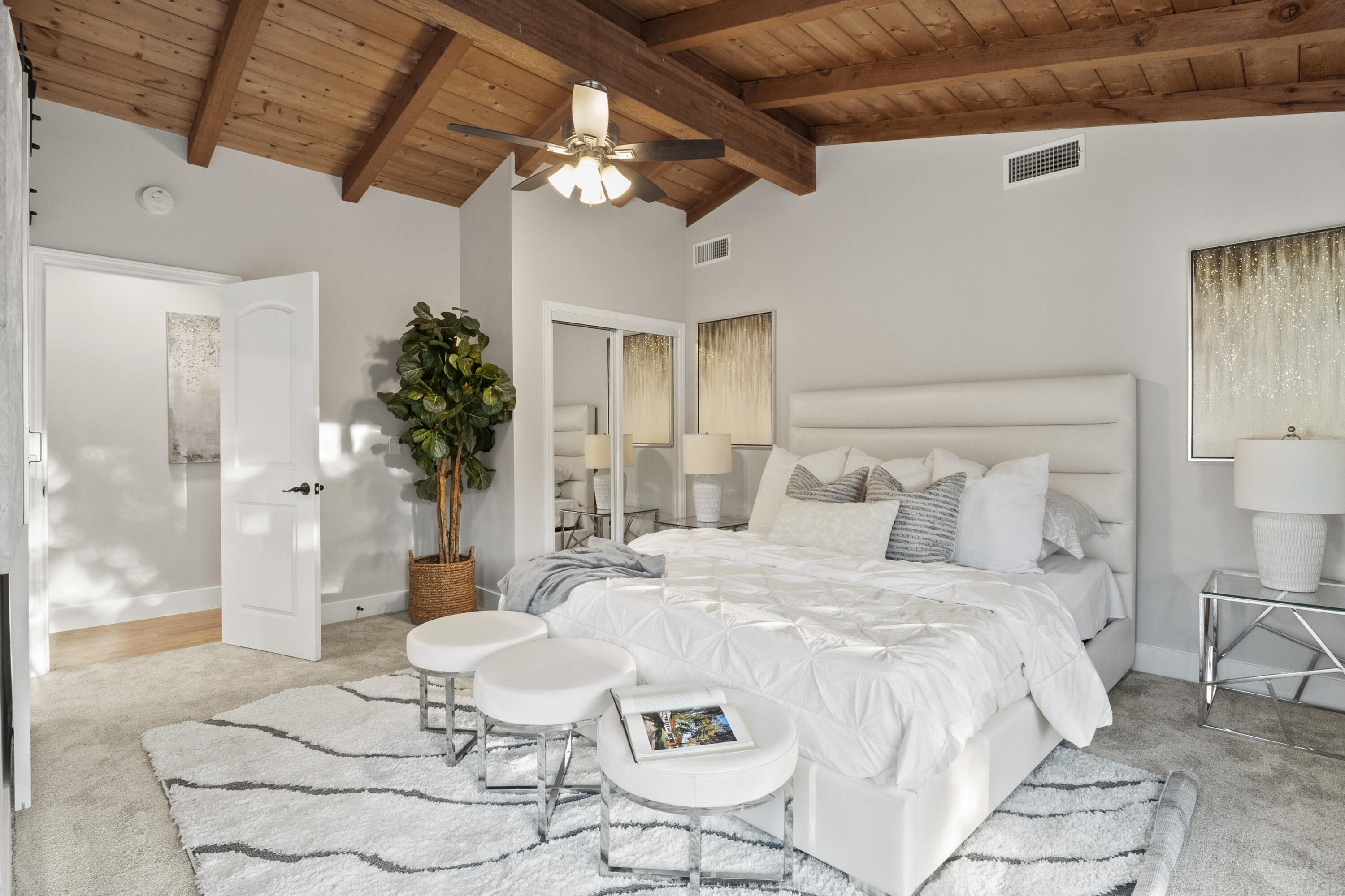 1530 Crestview Trail Acton, CA 93510 - Photo 13 of 43 a large white bed sitting in a bedroom next to a chandelier