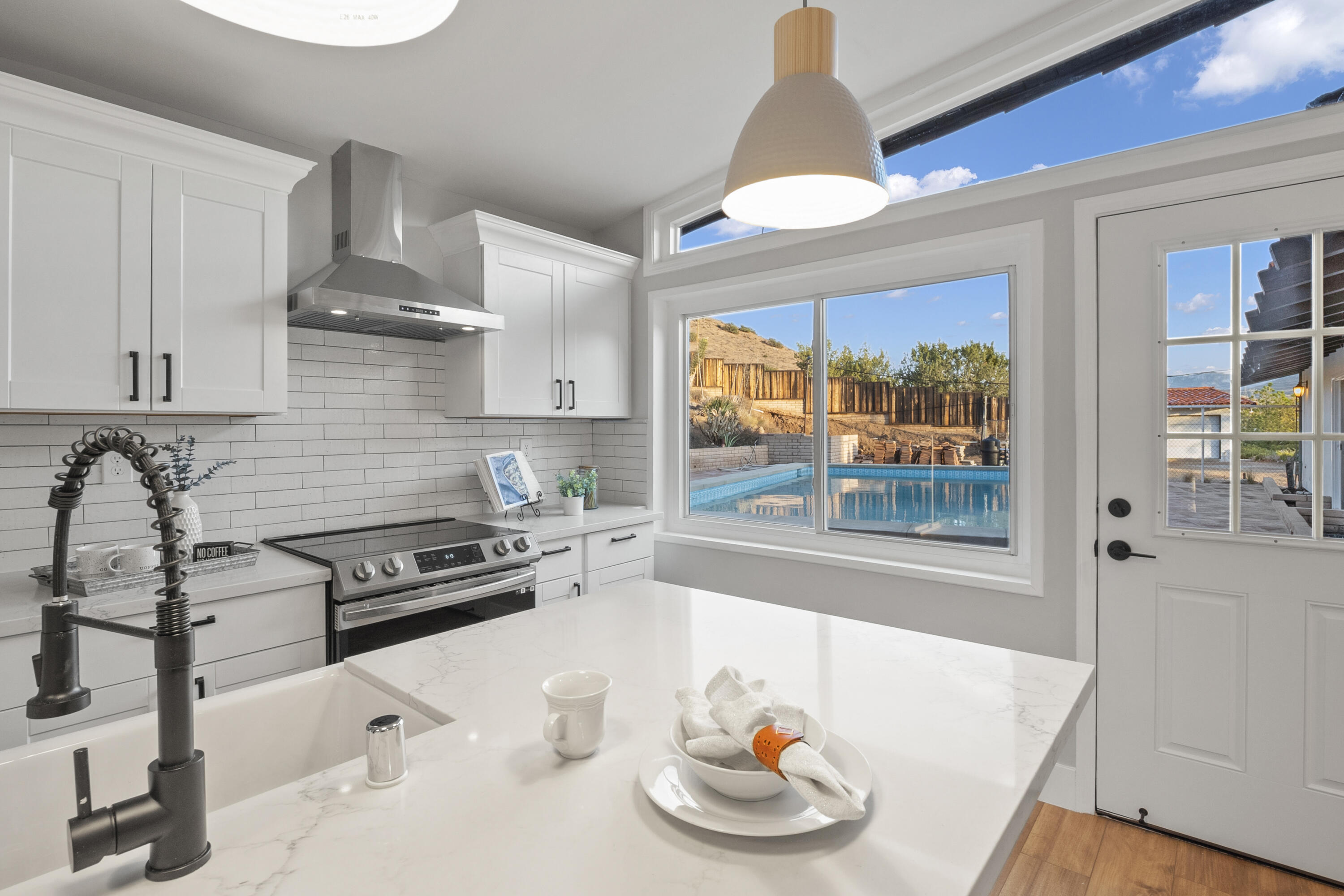 1530 Crestview Trail Acton, CA 93510 - Photo 22 of 43 a kitchen with a stove a refrigerator and a window