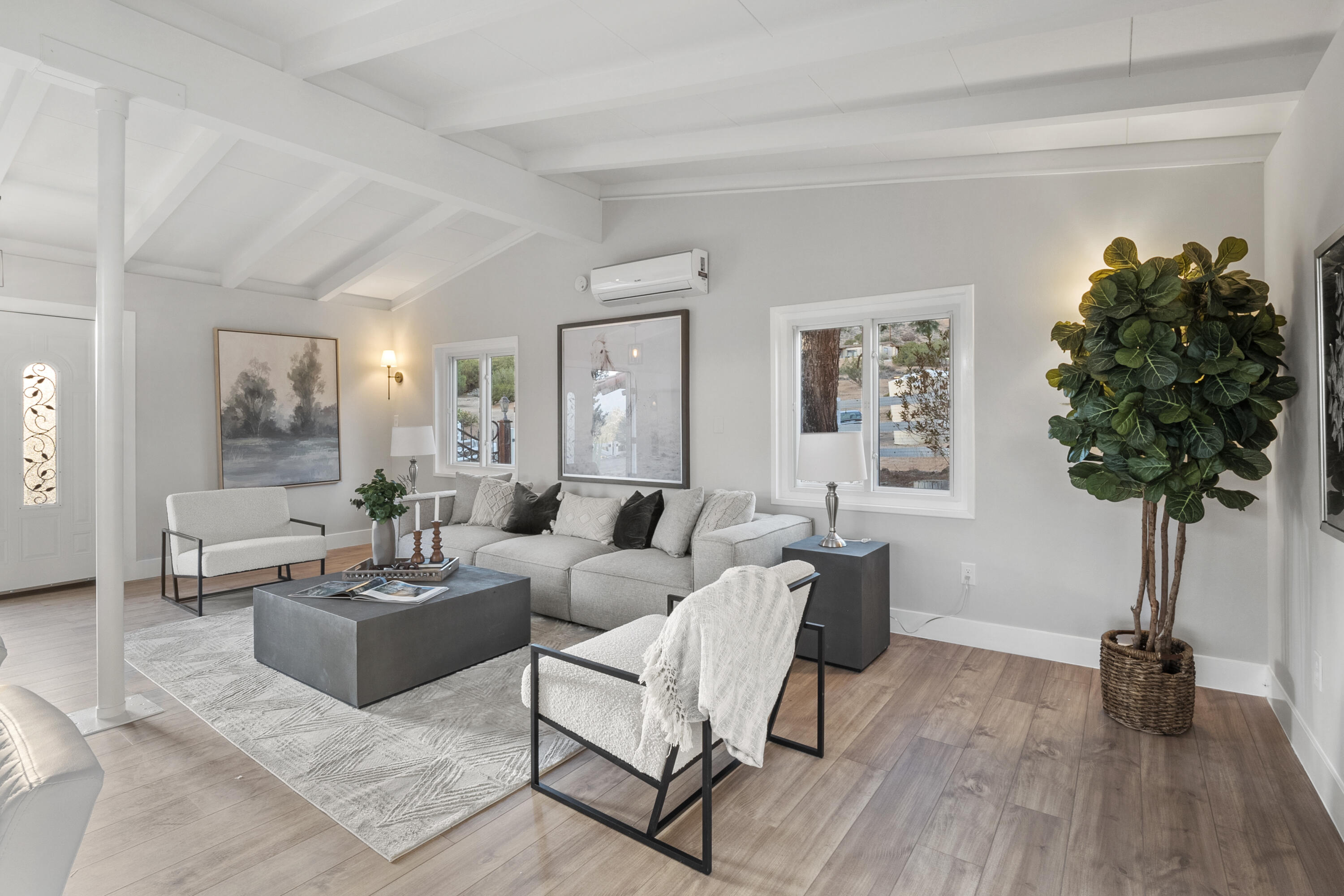 1530 Crestview Trail Acton, CA 93510 - Photo 29 of 43 a living room with furniture potted plant and a window