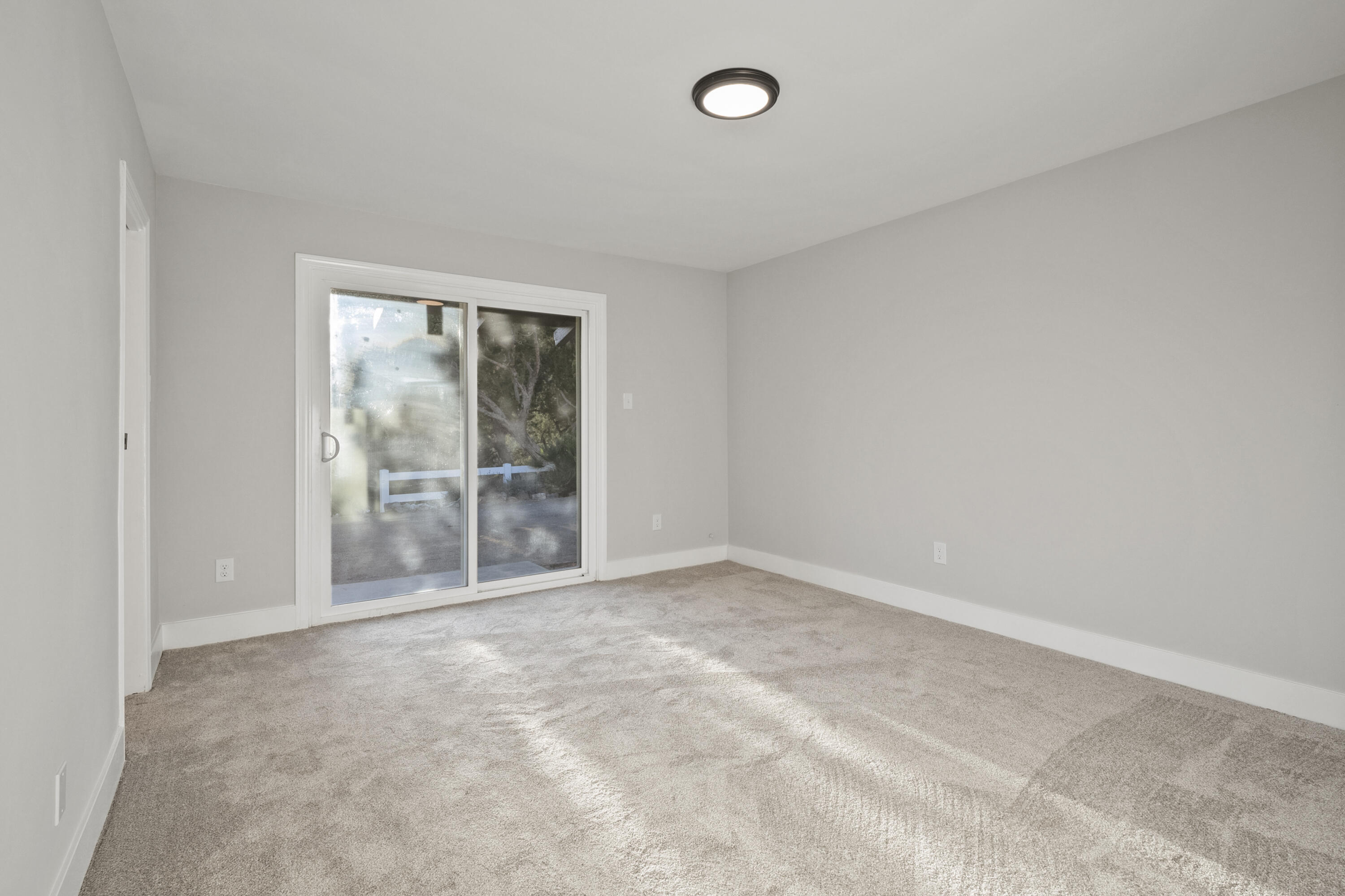 1530 Crestview Trail Acton, CA 93510 - Photo 9 of 43 an empty room with wooden floor and windows