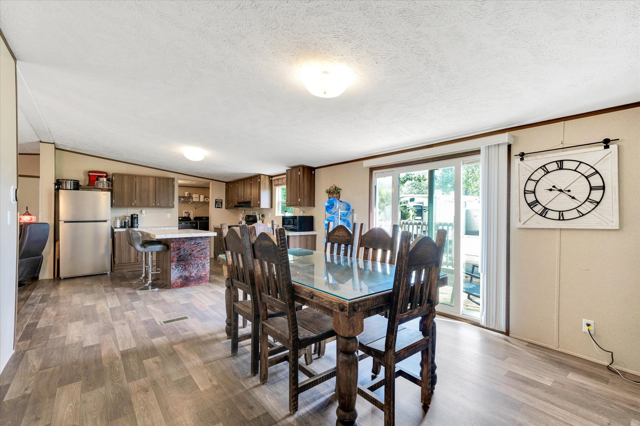 2755 Washburn Road Luling, TX 78648 - Photo 40 of 40 An inviting open floorplan combines the dining space and kitchen with durable wood-look flooring.