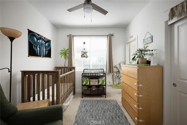 a bedroom with furniture and a window