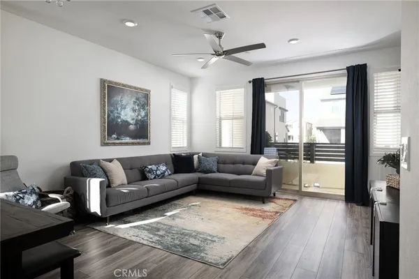 a living room with furniture and a large window
