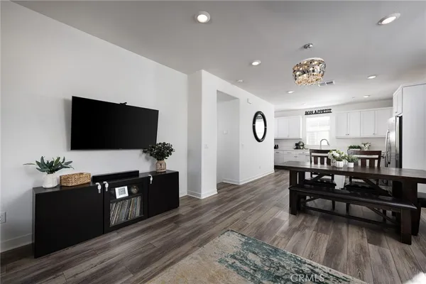 a view of a livingroom with furniture and wooden floor