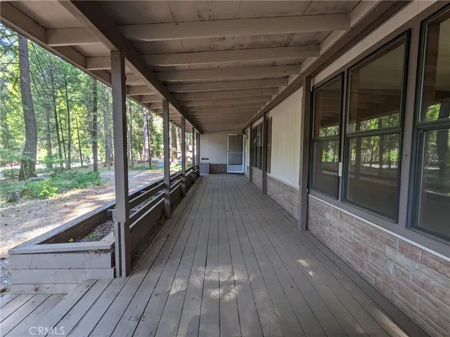 a view of a porch with wooden floor