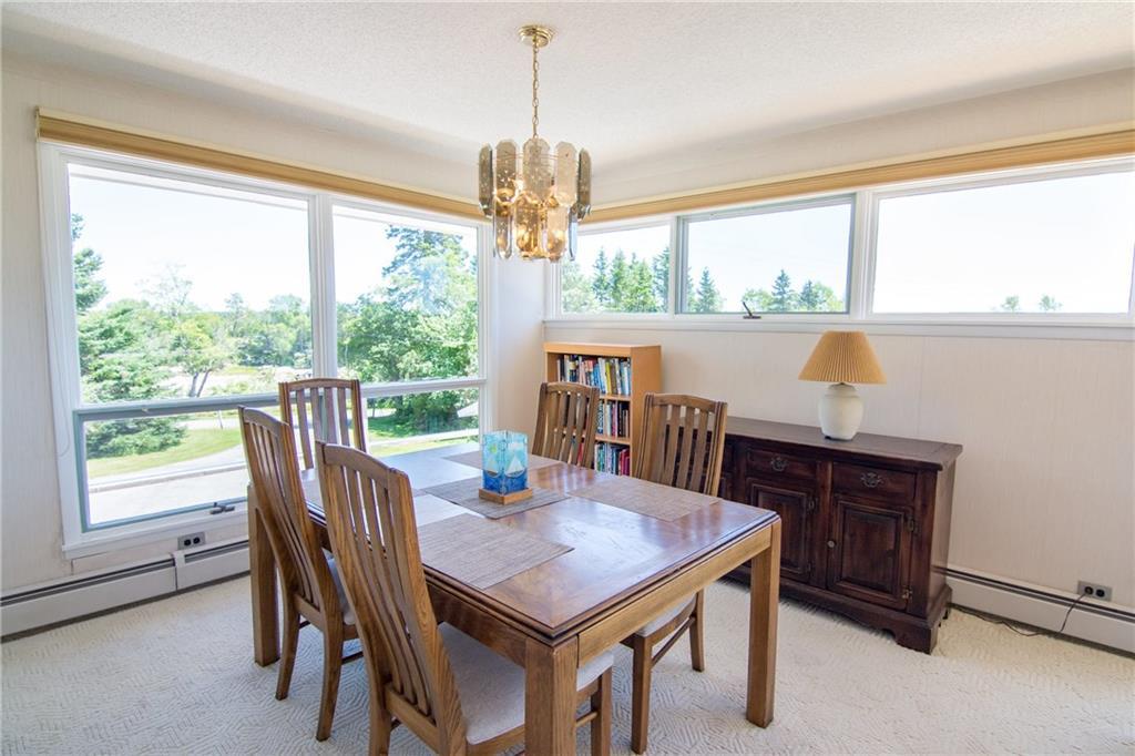 325 Ficketts Point Road Milbridge, ME 04658 - Photo 20 of 35 Dining room. Full of light.