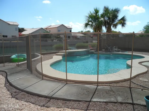a small pool with an outdoor seating
