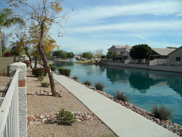 a view of a lake in between two chairs