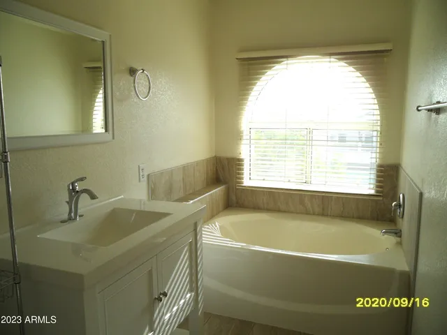 a bathroom with a bathtub and a sink