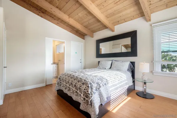 a bedroom with a bed and window