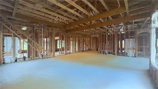 a view of an empty room with glass door