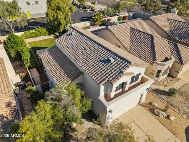 a view of a patio with table and chairs and potted plants