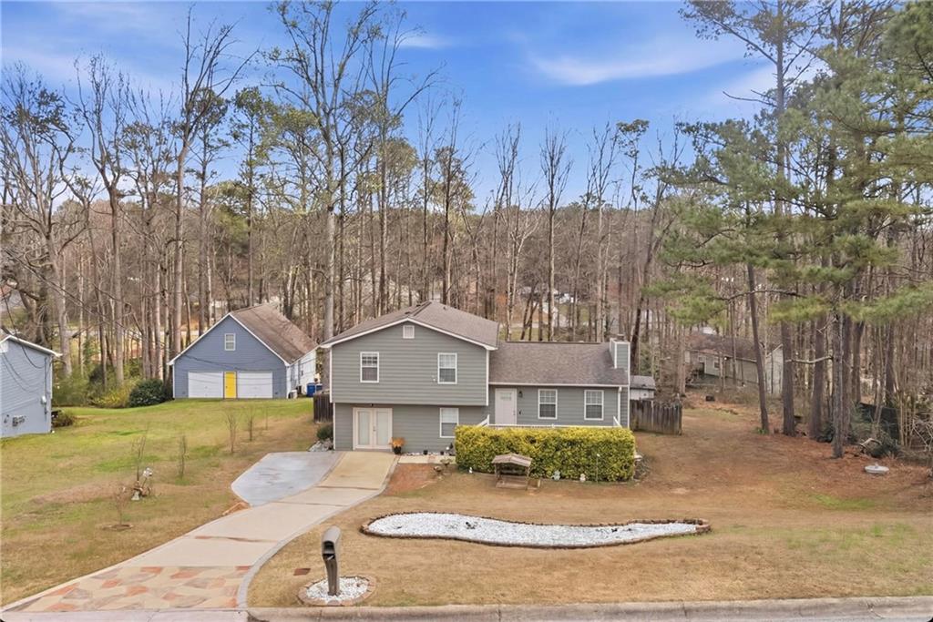 3123 Booths Court Dacula, GA 30019 - Photo 1 of 56 a front view of a house with a yard