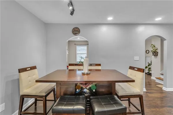 a view of a dining room with furniture and wooden floor