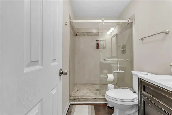 a en suite bathroom with a sink a mirror and a shower