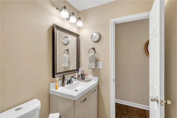 a bedroom with furniture and a flat screen tv