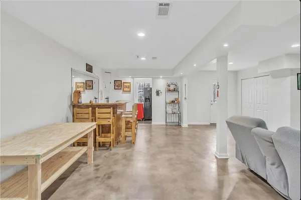 a living room with furniture and a table