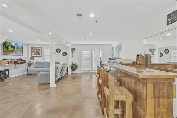 a kitchen with cabinets and chairs