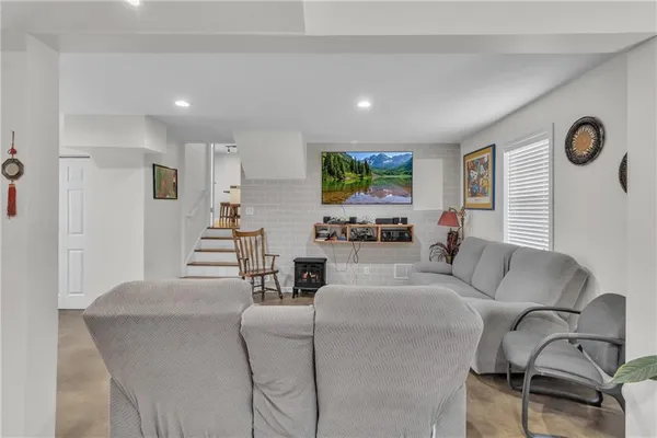 a bathroom with a toilet a sink and a mirror