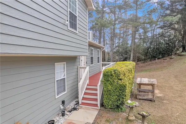 a balcony view with a seating space