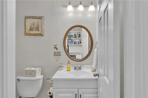 a kitchen with a refrigerator sink and cabinets