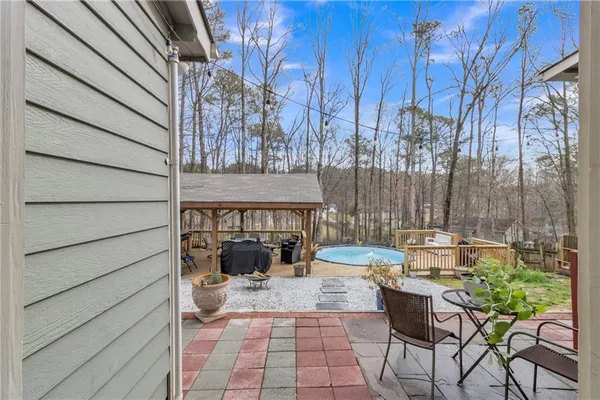 an aerial view of a house with table and chairs