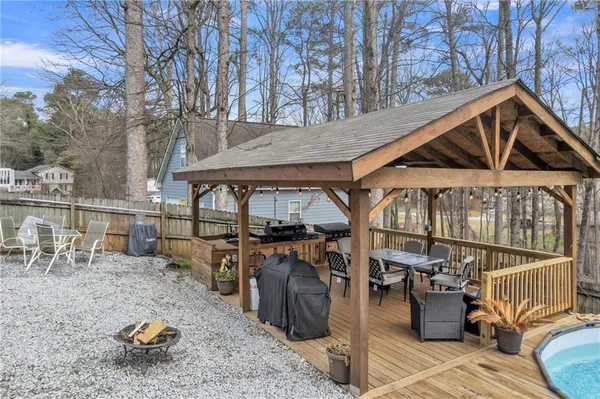 a view of a dining room with furniture wooden floor and a chandelier