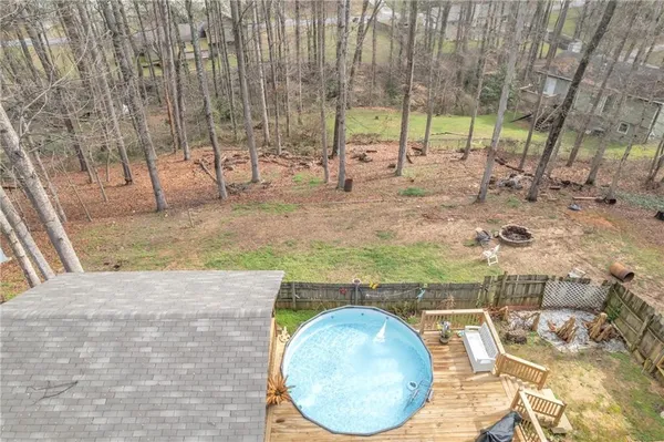 a view of a house with a yard and pathway