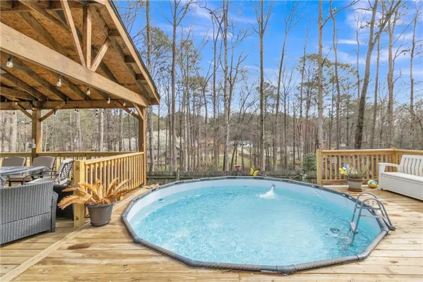 a picture of a bench in front of a wall