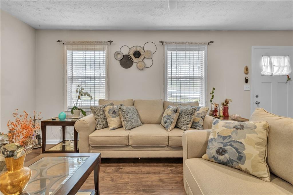 3123 Booths Court Dacula, GA 30019 - Photo 9 of 56 a living room with furniture and a large window