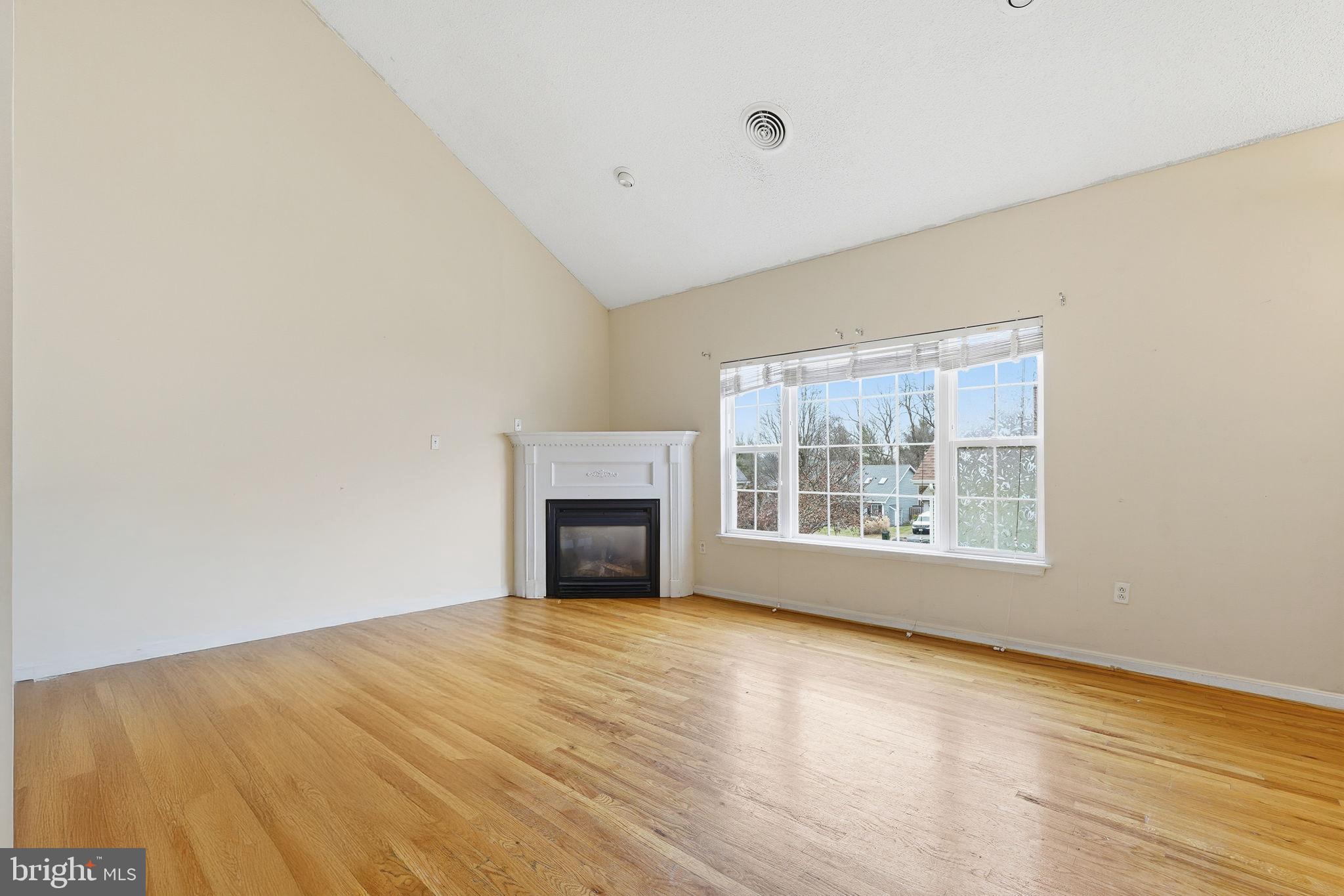 110 Rugby Place Winchester, VA 22603 - Photo 13 of 41 a view of empty room with wooden floor and fan