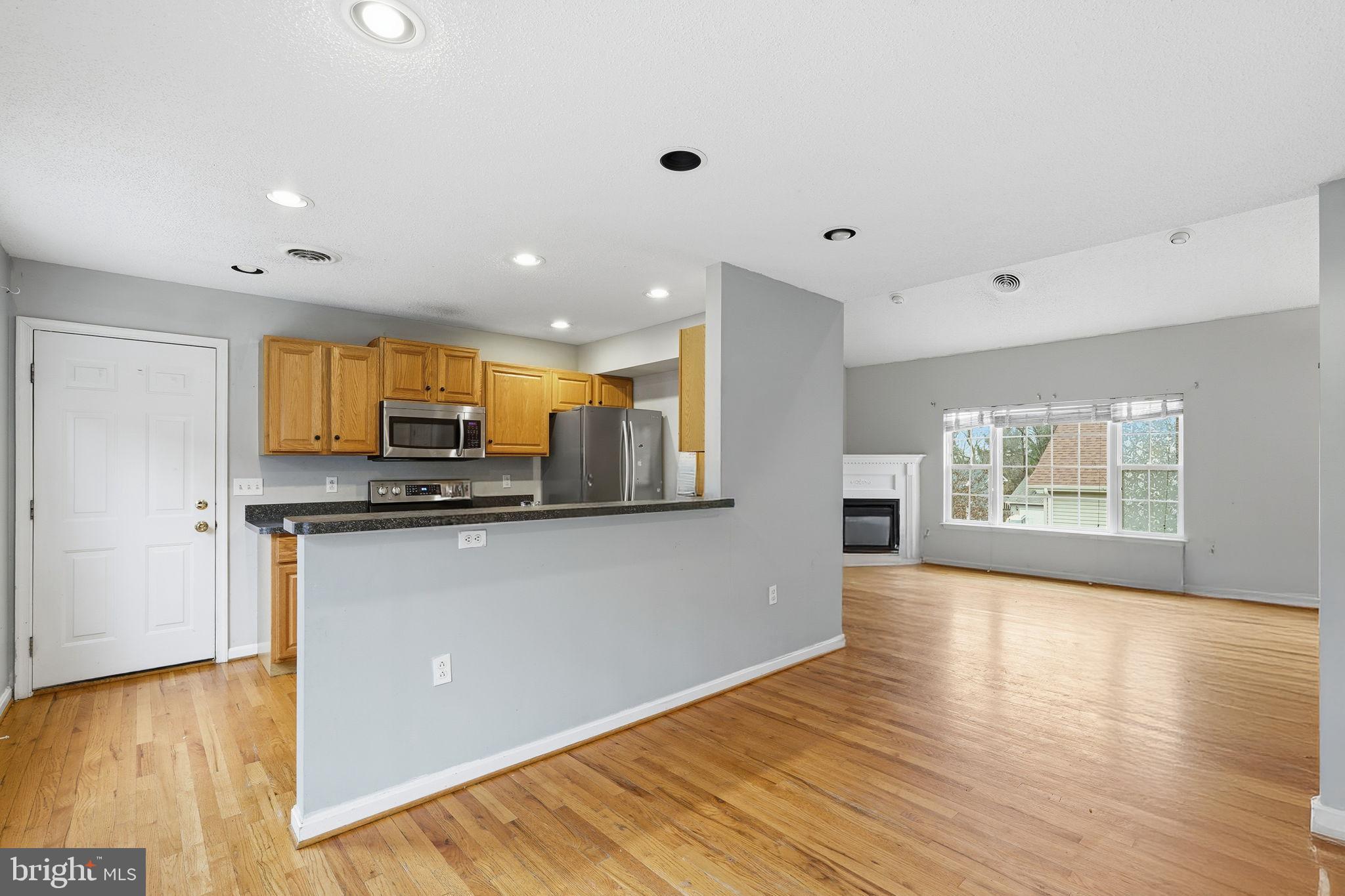 110 Rugby Place Winchester, VA 22603 - Photo 6 of 41 a view of kitchen with stainless steel appliances granite countertop a refrigerator and a stove top oven