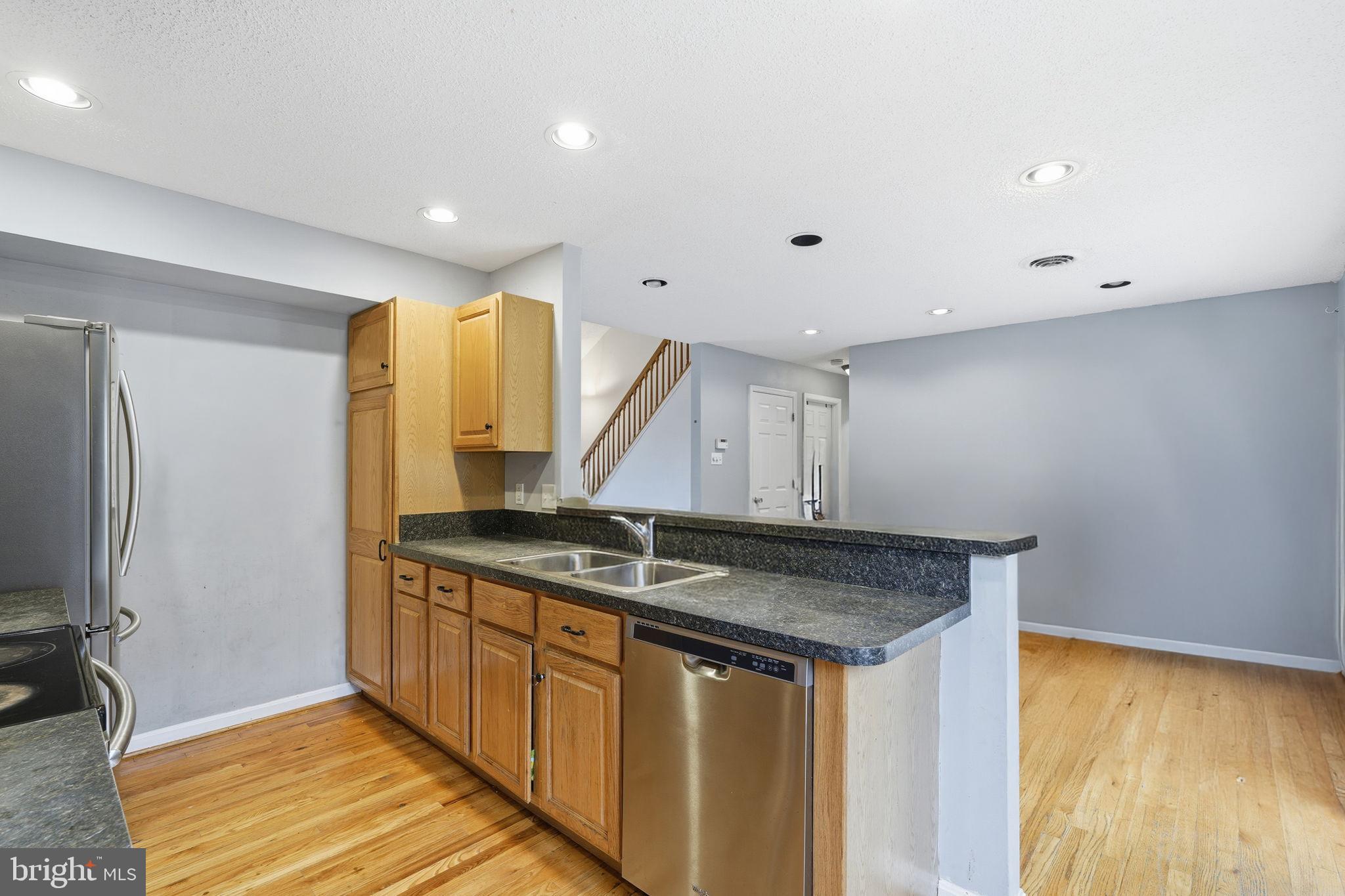 110 Rugby Place Winchester, VA 22603 - Photo 8 of 41 a kitchen with stainless steel appliances granite countertop a sink and a refrigerator