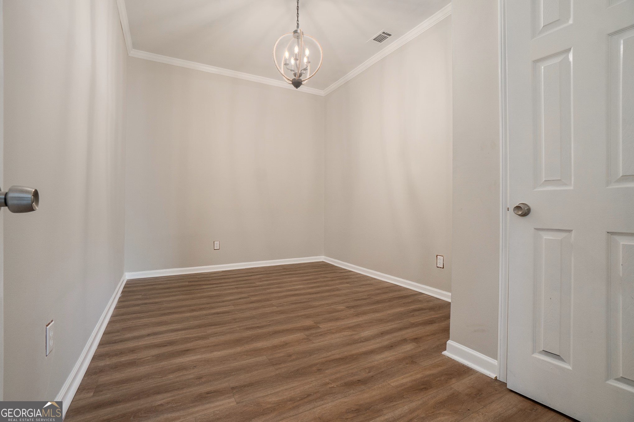 4395 Celebration Drive Southwest Atlanta, GA 30331 - Photo 11 of 25 a view of an empty room with wooden floor