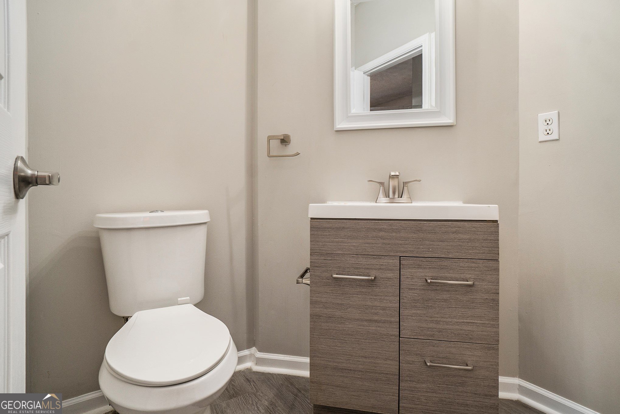 4395 Celebration Drive Southwest Atlanta, GA 30331 - Photo 14 of 25 a bathroom with a toilet sink and mirror