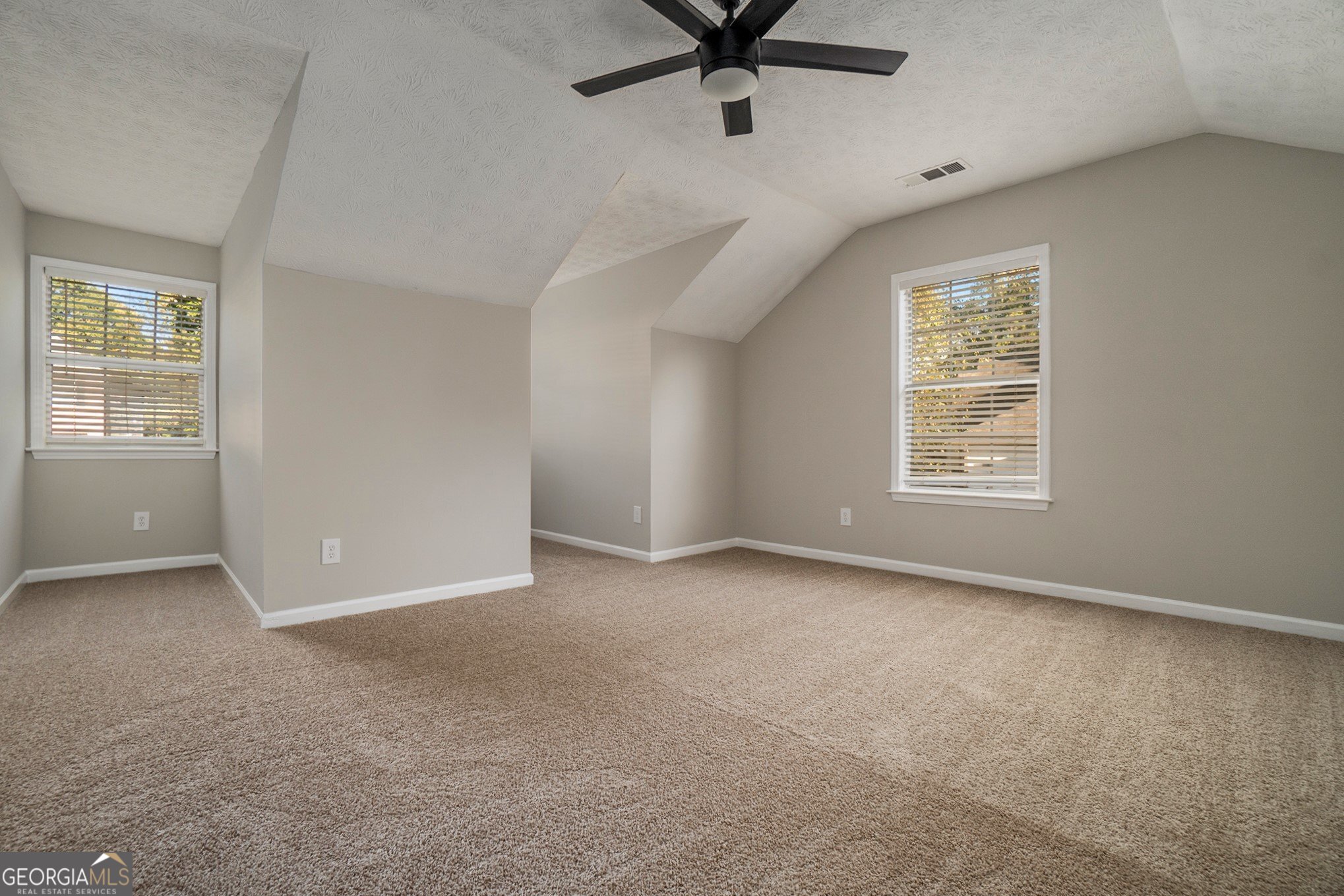 4395 Celebration Drive Southwest Atlanta, GA 30331 - Photo 22 of 25 an empty room with a window and a fan