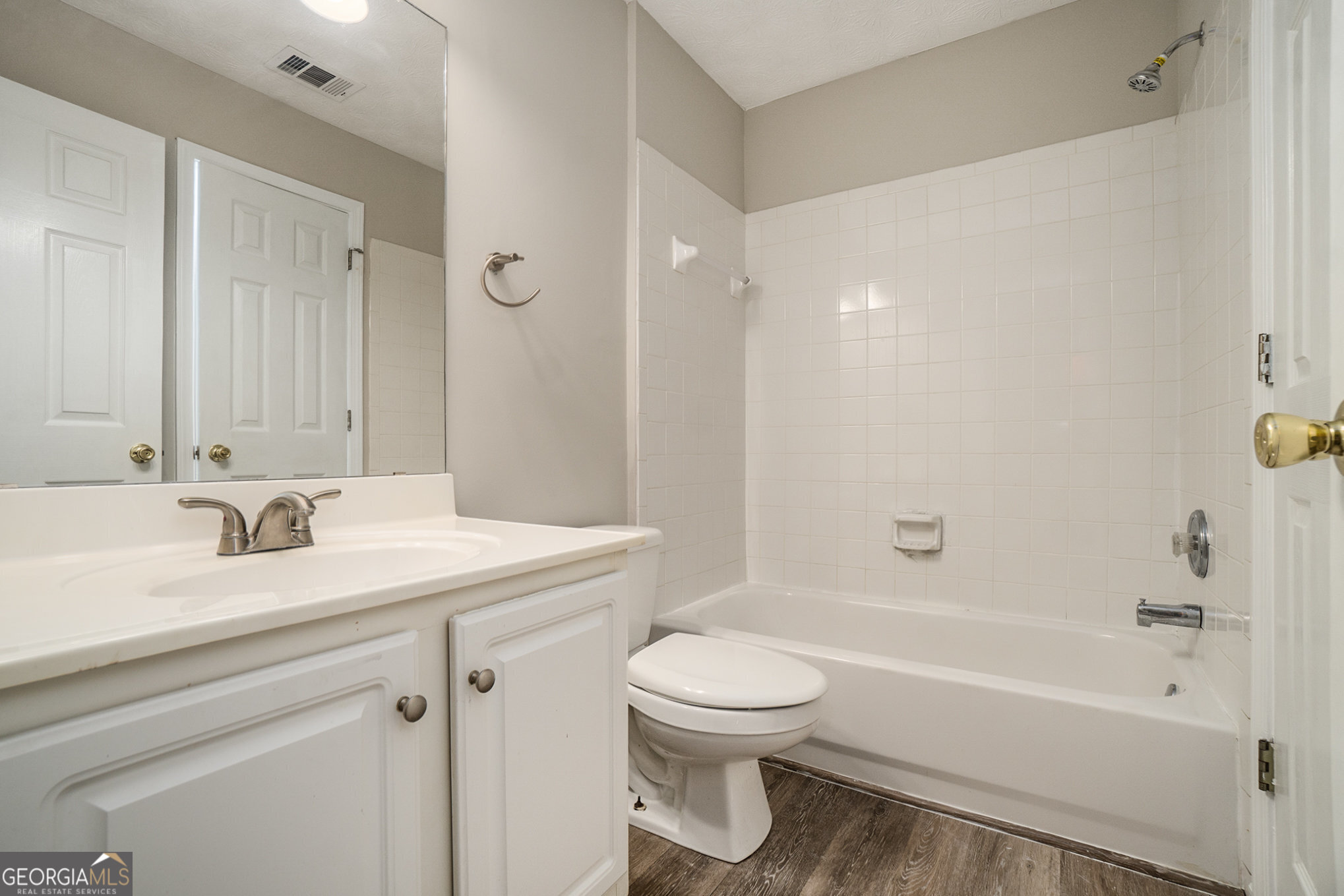 4395 Celebration Drive Southwest Atlanta, GA 30331 - Photo 23 of 25 a bathroom with a sink a toilet and a bathtub