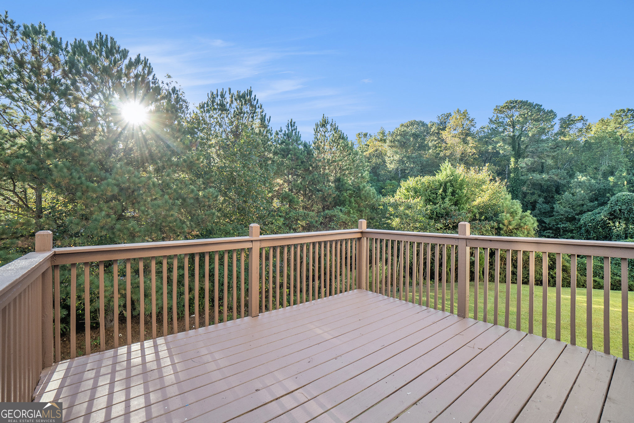 4395 Celebration Drive Southwest Atlanta, GA 30331 - Photo 24 of 25 a balcony with wooden floor and fence