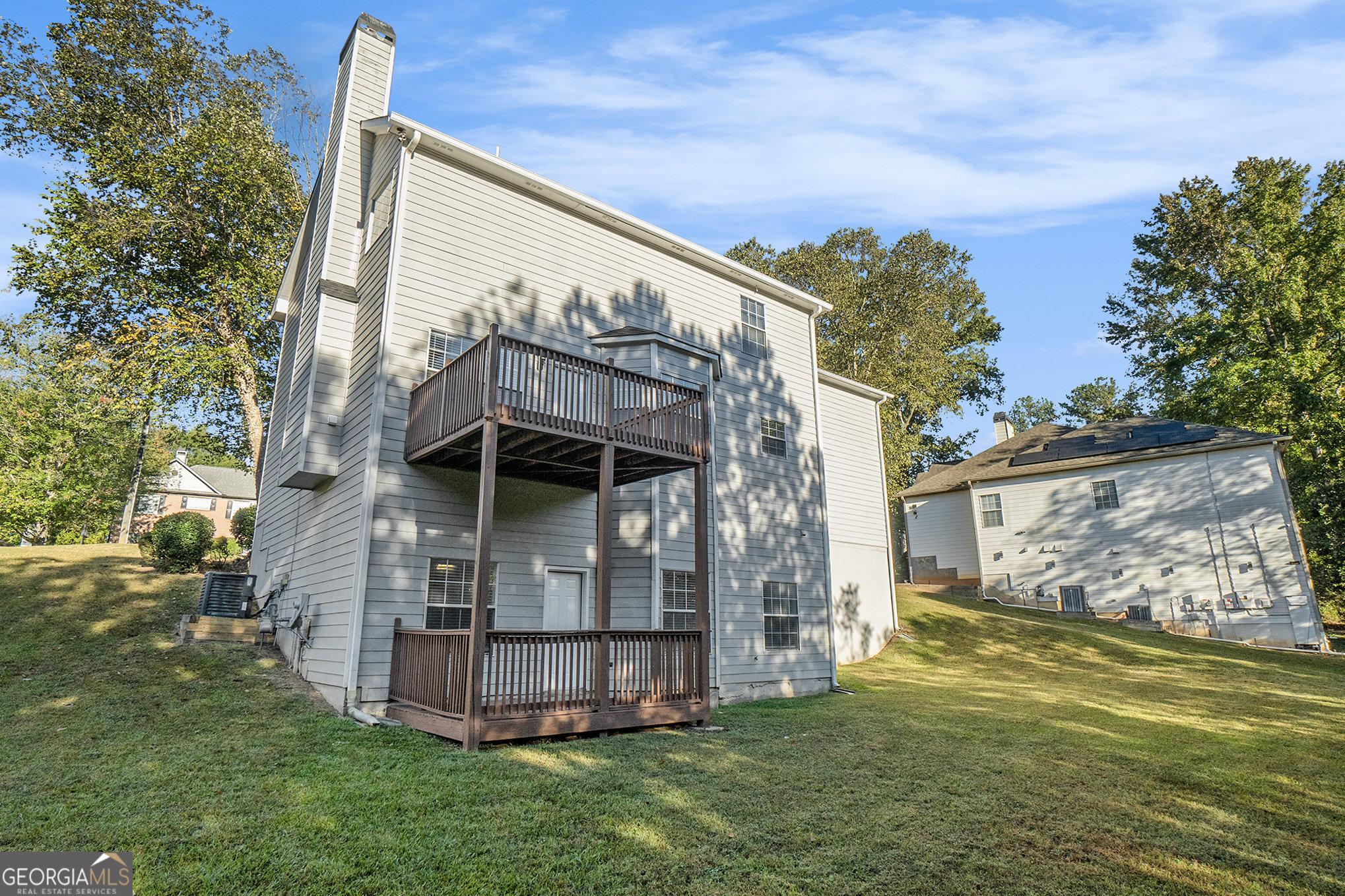 4395 Celebration Drive Southwest Atlanta, GA 30331 - Photo 25 of 25 a view of a small house with a big yard and large trees