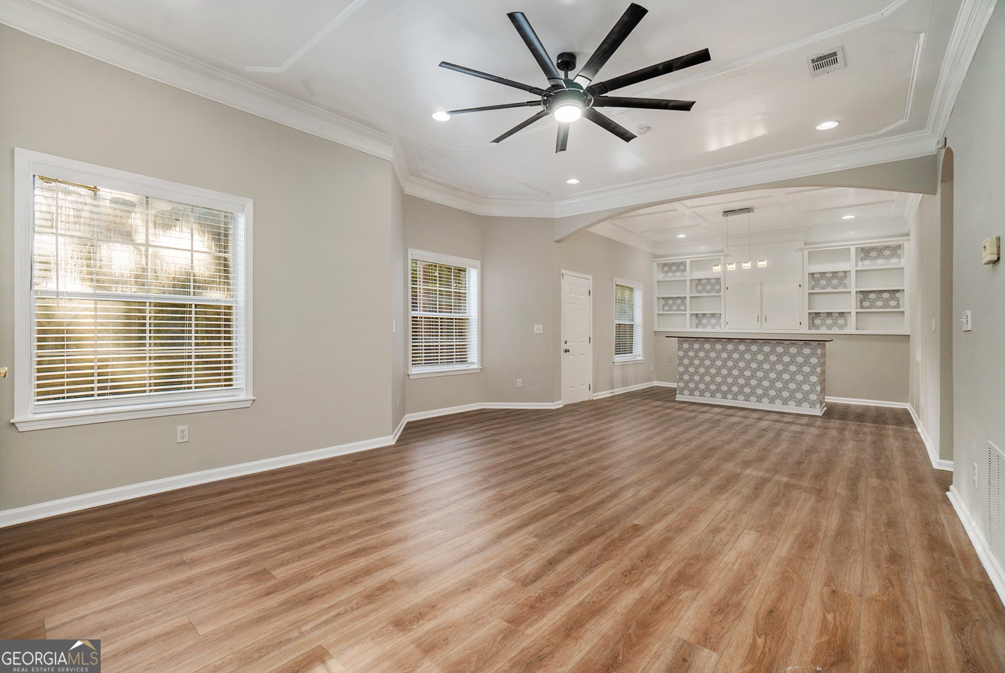 4395 Celebration Drive Southwest Atlanta, GA 30331 - Photo 8 of 25 a view of an empty room with wooden floor and a window