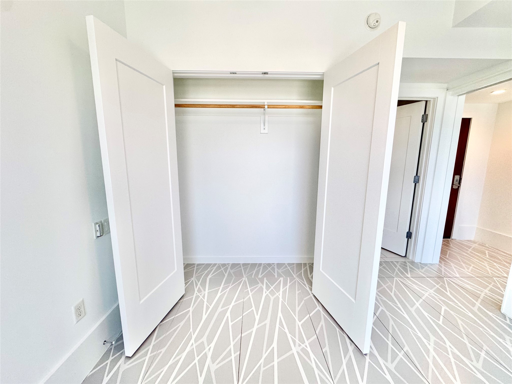 2201 Market Street, Unit 1101 Galveston, TX 77550 - Photo 11 of 12 a view of a room with wooden floor and a bathroom