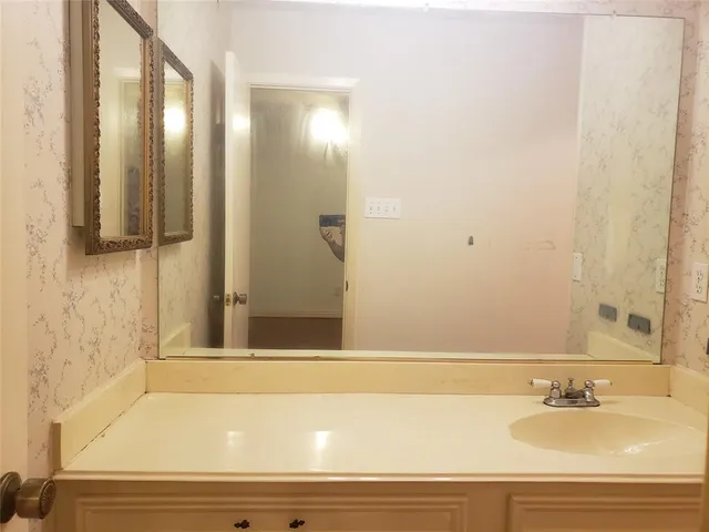 a bathroom with a bathtub and a sink