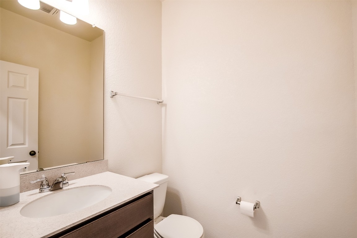 1924 Stringer Pass Leander, TX 78641 - Photo 17 of 34 a bathroom with a sink toilet and mirror