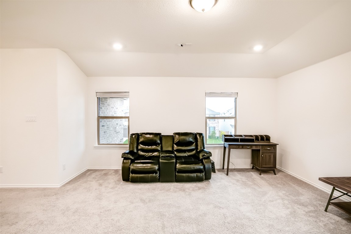 1924 Stringer Pass Leander, TX 78641 - Photo 19 of 34 a living room with furniture a window and a lamp