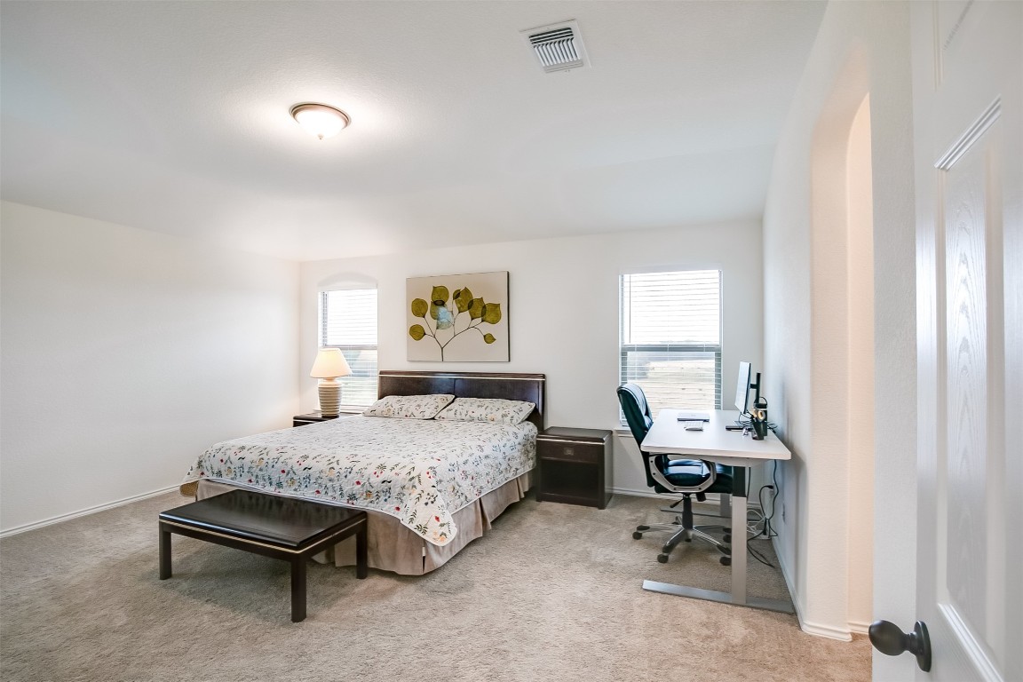 1924 Stringer Pass Leander, TX 78641 - Photo 20 of 34 a bedroom with a bed and a window